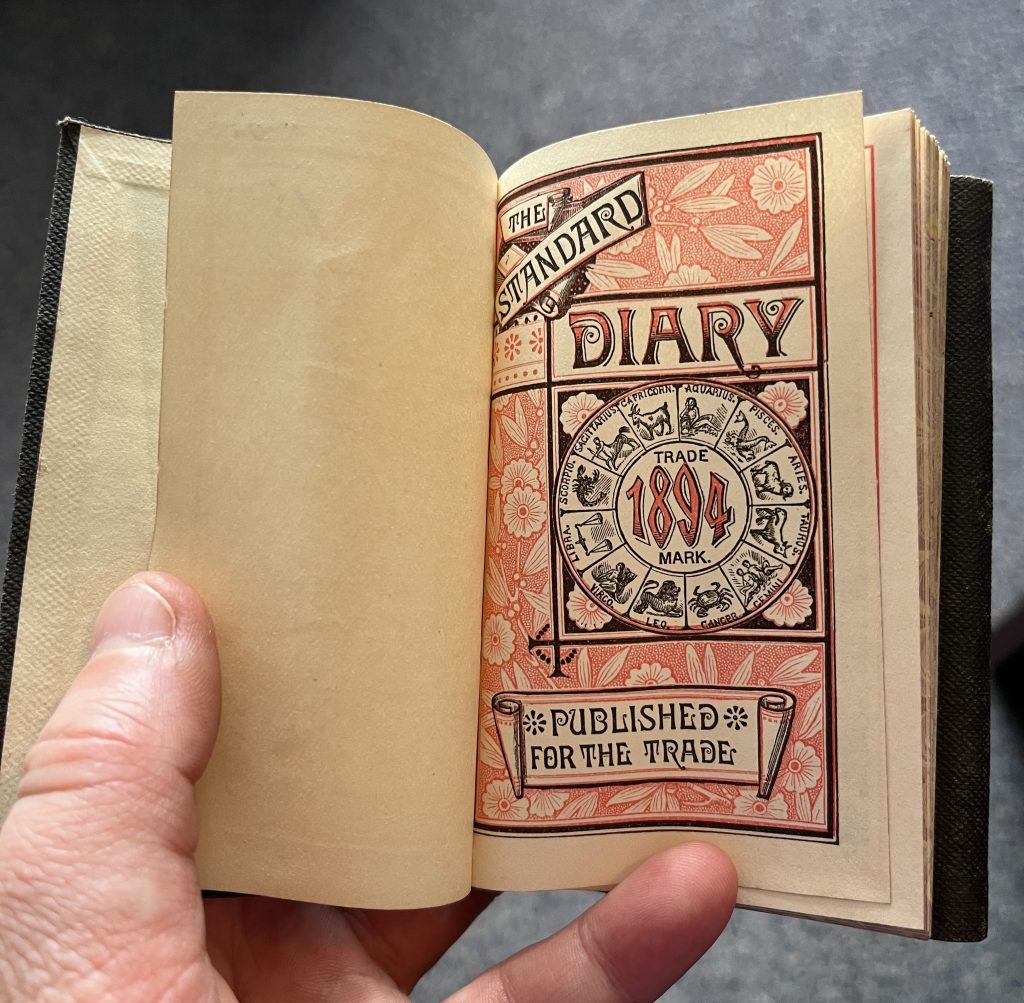 First page in an 1894 diaries with the text "The Standard Diary,: 1894 and "Published for the Trade" with a circle of zodiac symbols